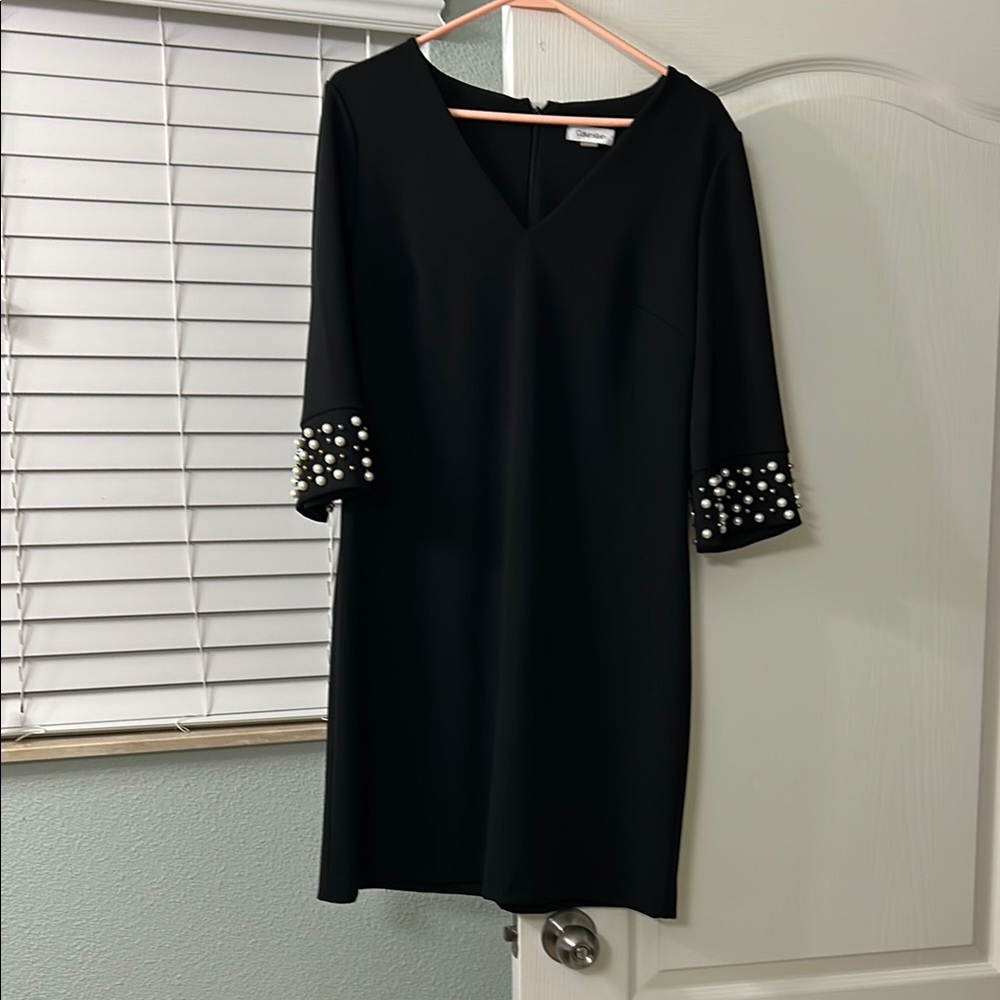 Elegant Black Dress with Pearl Accents